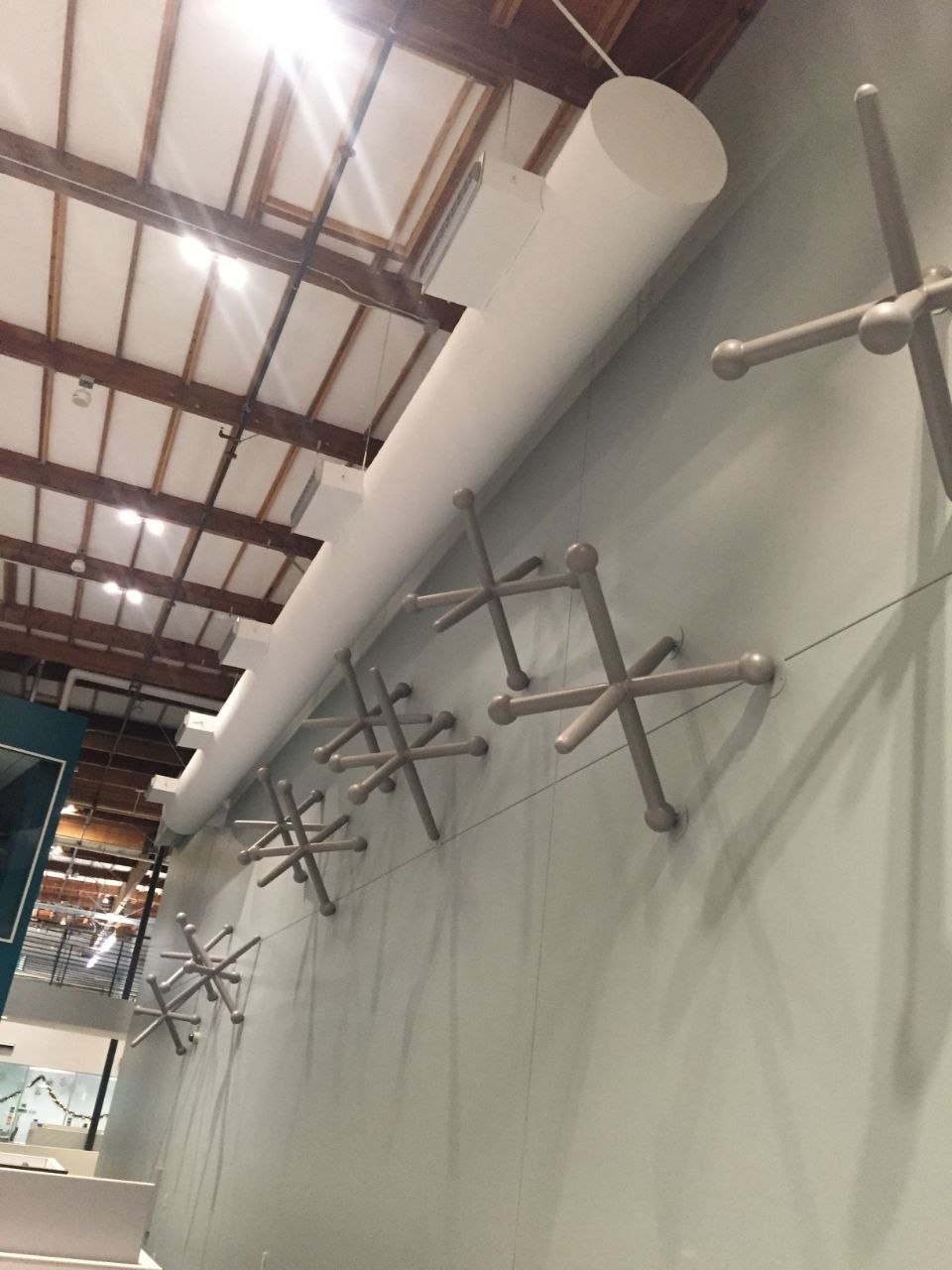 Close up of the massive 5-foot brushed stainless steel Jack light fixtures