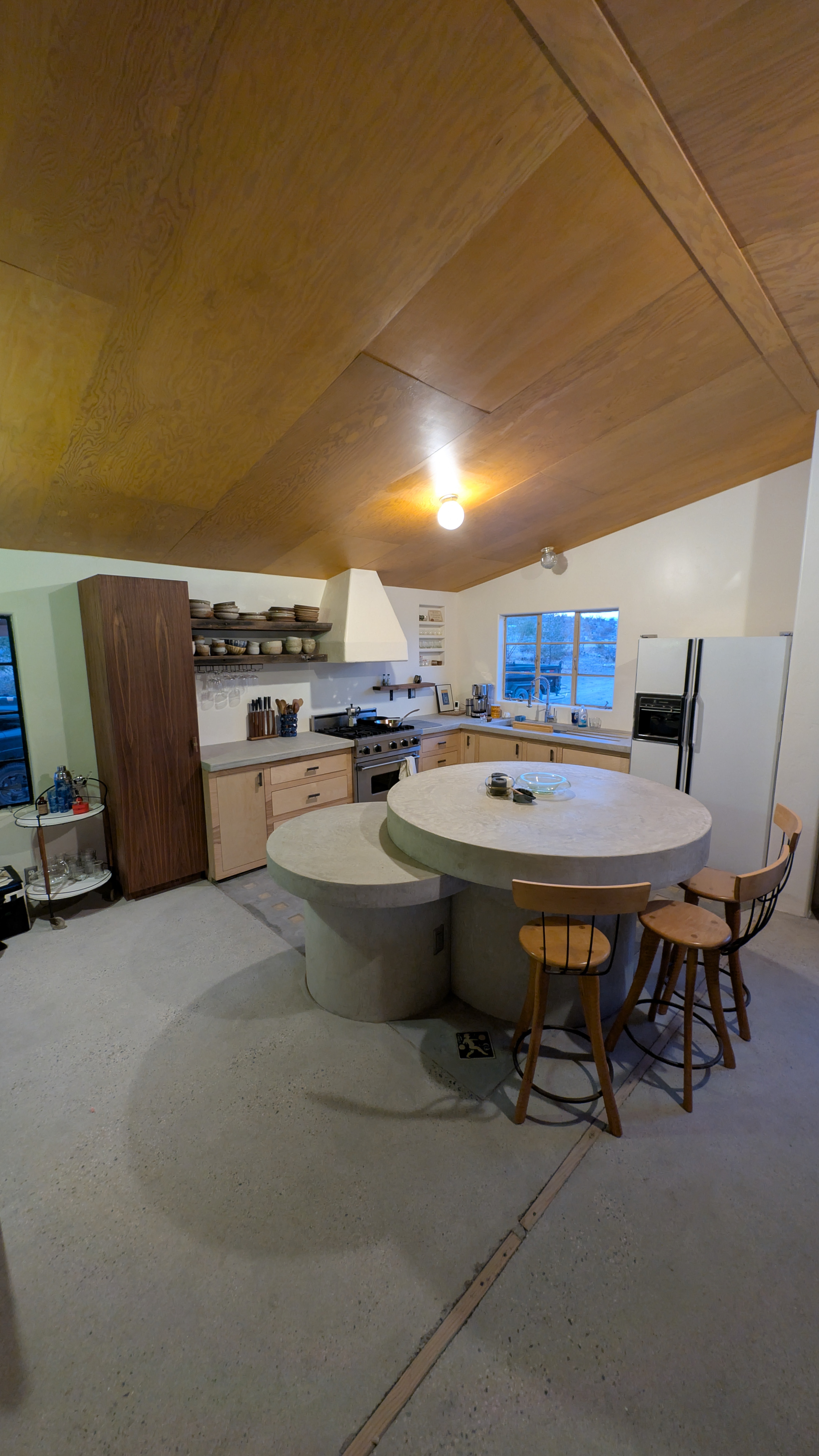 Deep red micro-cement shower pan and flagstone wall transition