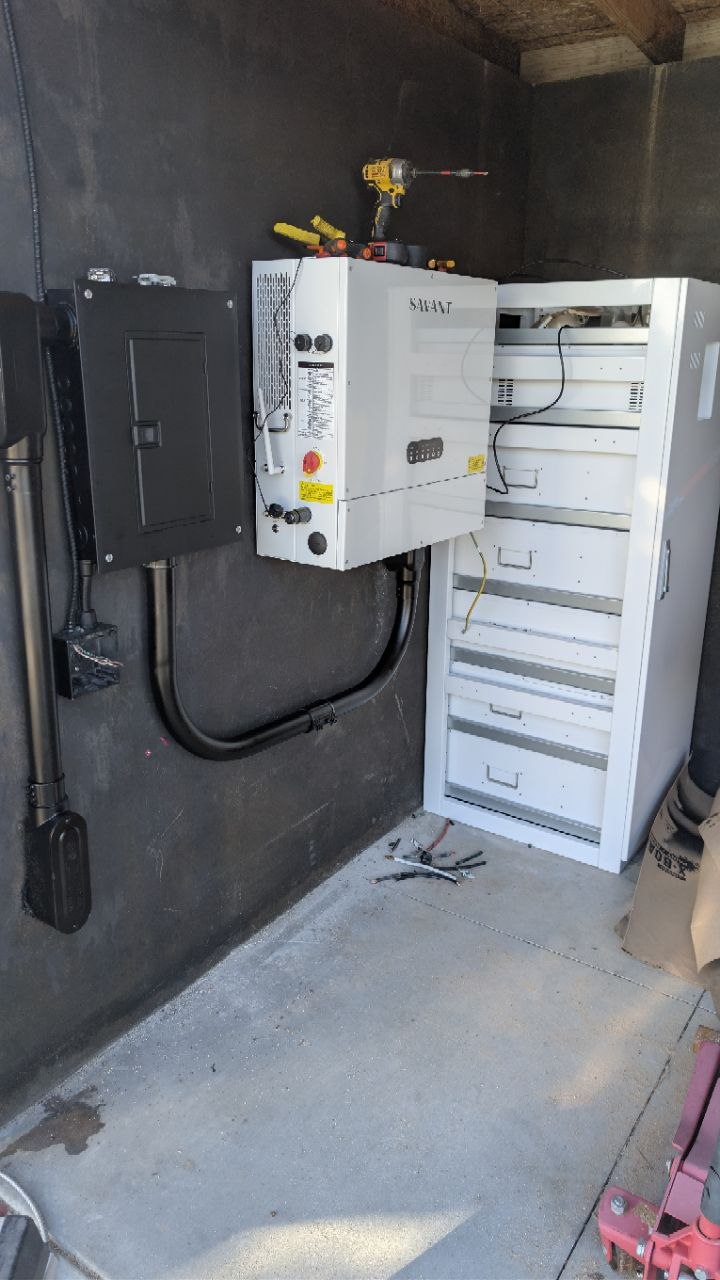 Savant Power System inverter and battery cabinet installed inside the shed