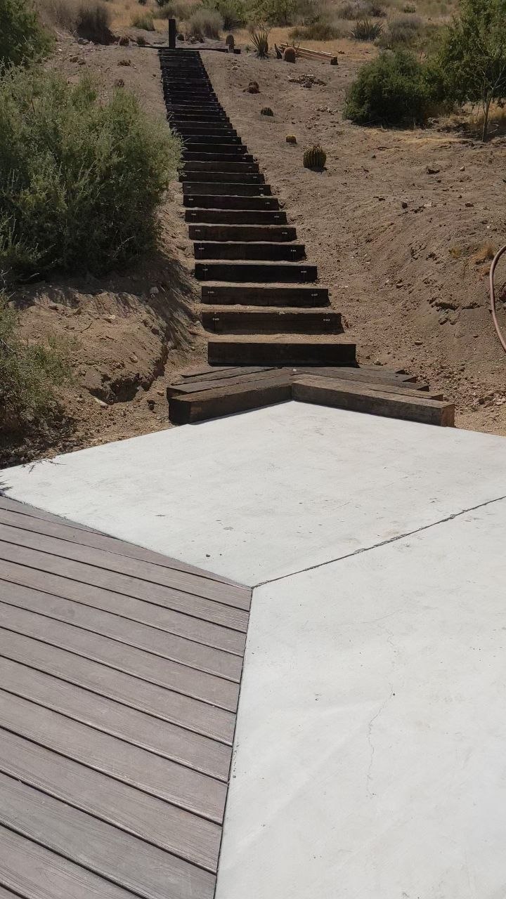 Reclaimed railroad tie steps traversing the desert hill