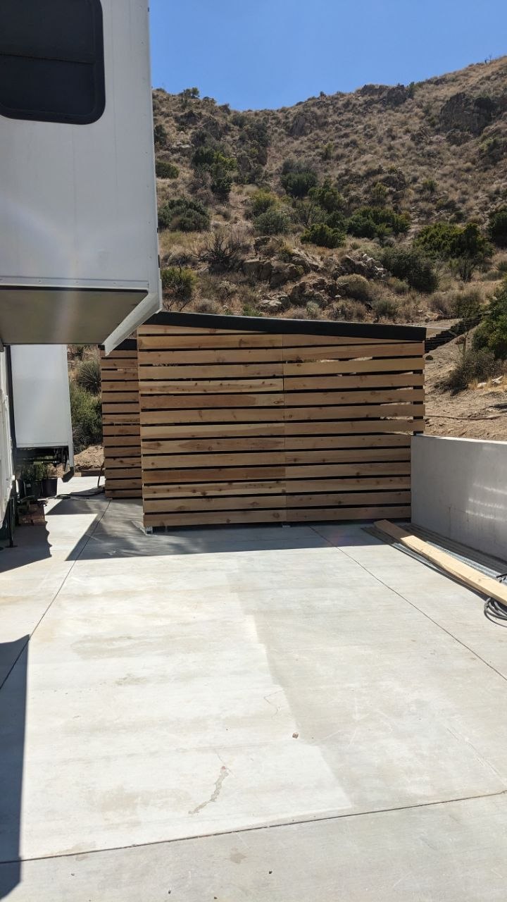Custom wood slat privacy fencing around the ADU