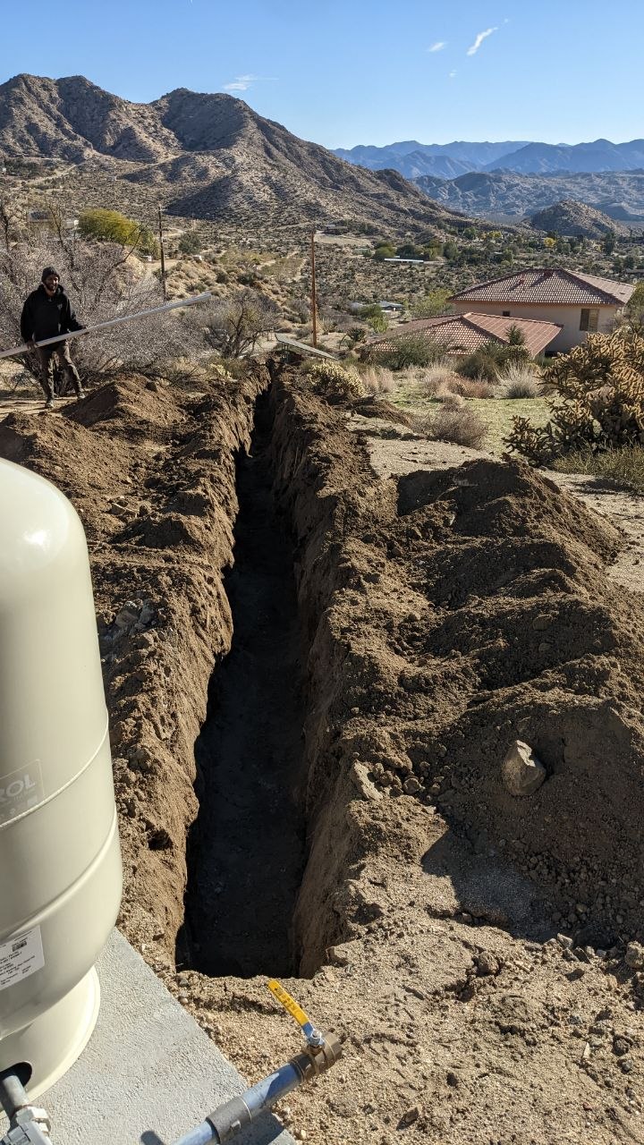 Deep utility trenching across the desert property
