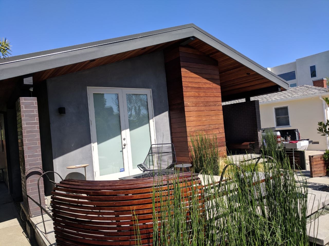 Custom curved wood slatted furniture and firepit