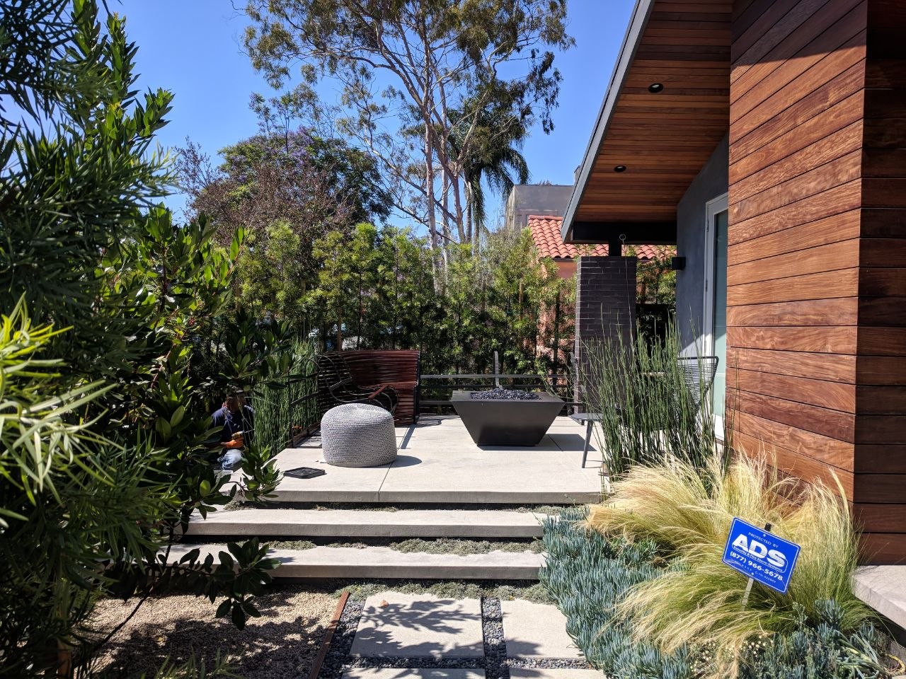 Fully finished exterior courtyard with native landscaping