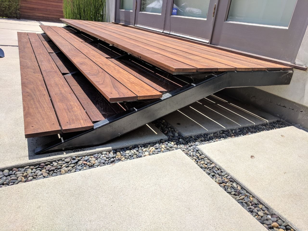 Side profile of steel stringer floating steps with Brazilian hardwood