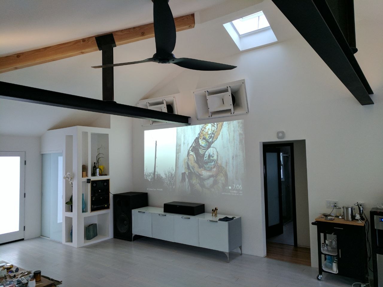 Finished interior with exposed steel beam and integrated audio