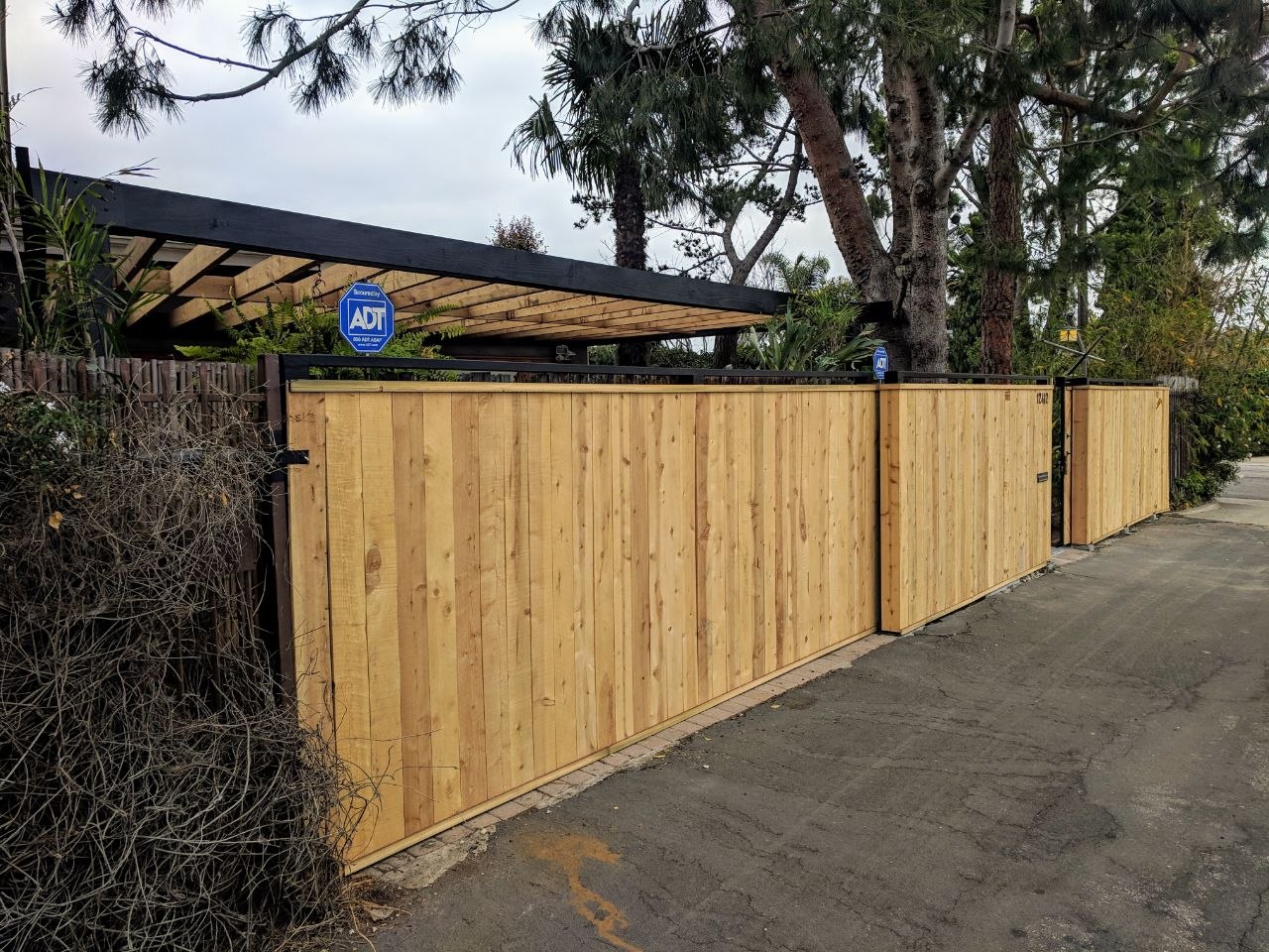 Custom stainless steel modern art piece mounted over entryway