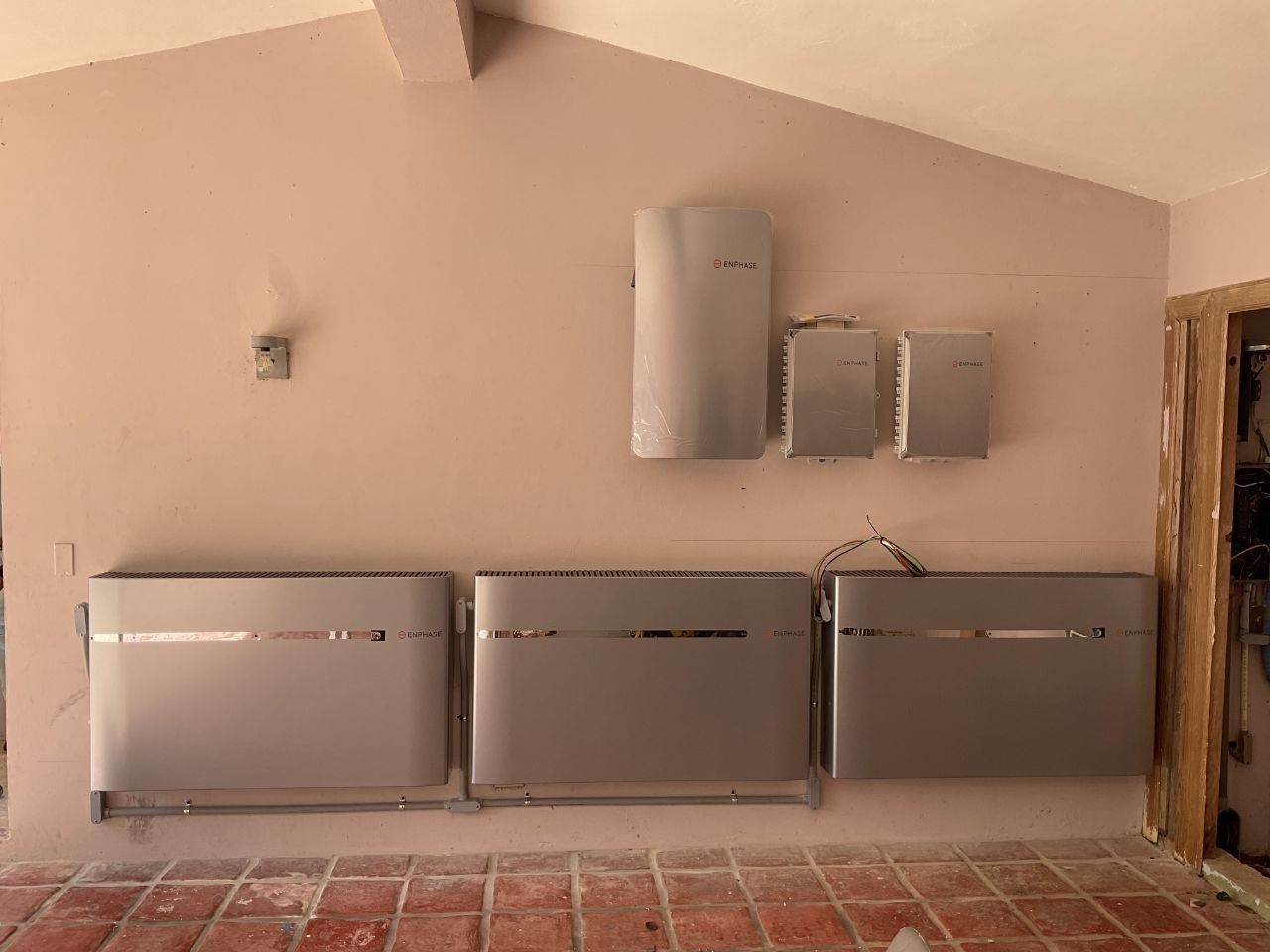Massive Enphase battery storage block mounted to the interior wall