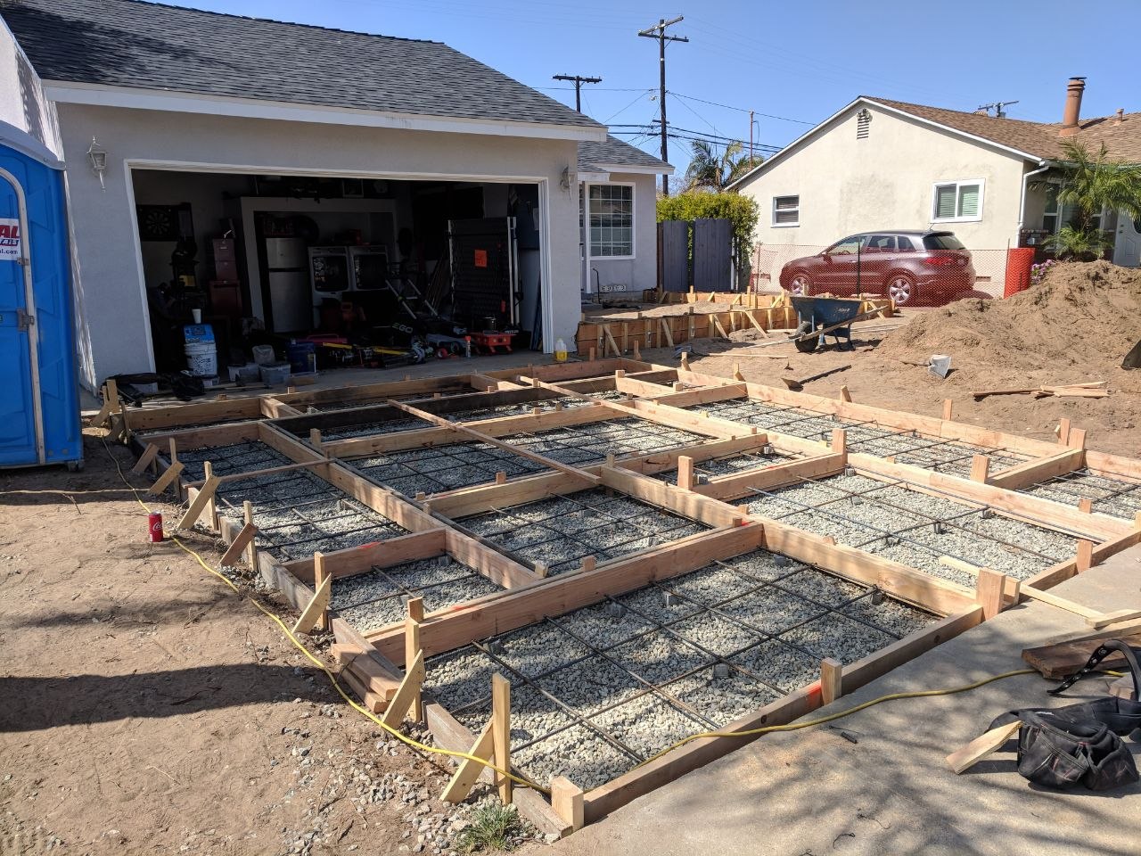 Rebar grid and wood formwork for the foundation addition