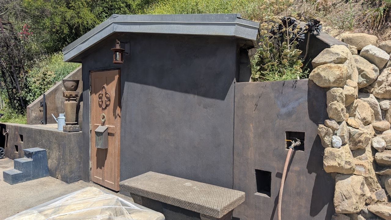 Custom stucco utility shed built 75 feet from the home to house the 40KWh battery system