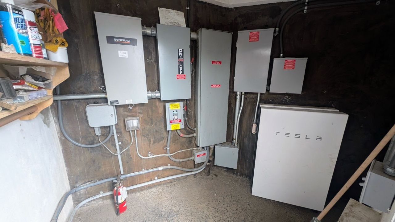 The original failing Tesla Powerwall system with Generac transfer switch before replacement